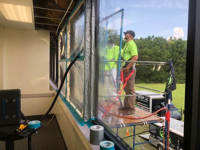 a water test on a building diagnosing the windows per ASTM/AAMA standards